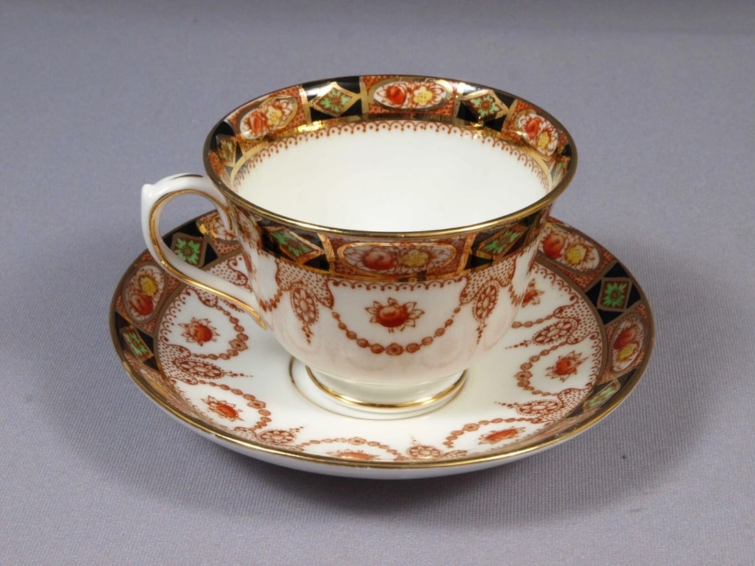 Royal Albert Crown China Devon Imari Green Coffee Tea Cup Saucer Set: This is a gorgeous set of Coffee/Tea Cup and Saucer. The set is made by Royal Albert in England. The pattern is Devon. It is properly marked with Royal Albert Crown China back stamp. According to Roya