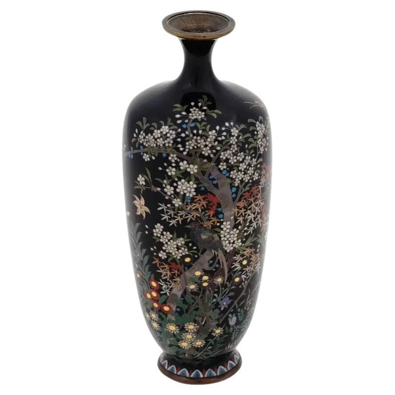Antique Japanese Cloisonne Meiji Era Enamel Vase Signed Hayashi Yojiro: About the Item An antique Japanese, late Meiji period, enamel over brass vase. The vase has an amphora shaped body and a narrow fluted neck. The ware is enameled with a polychrome image of a bird in b