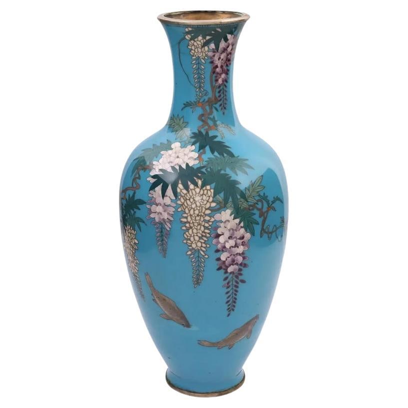 Rare Japanese Closionne Enamel Vase with Wisteria and Fish Signed: About the Item A rare antique Japanese, late Meiji period, enamel over copper vase. The vase has an amphora shaped body and a long fluted neck. The ware is enameled with a polychrome image of blossomi