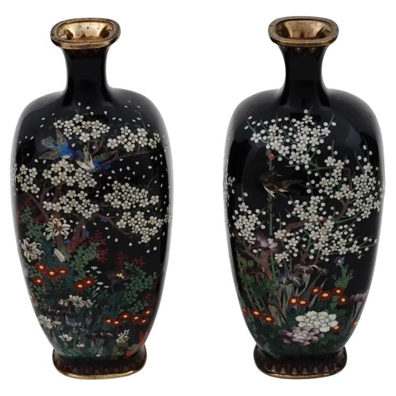 Pair of Antique Meiji Japanese Cloisonne Enamel Miniature Vases Birds in Cherry: About the Item A pair of antique Japanese, late Meiji period, silver wire enamel vases. Each vase has an amphora shaped body and a fluted neck. The wares are enameled with a polychrome image of a pair