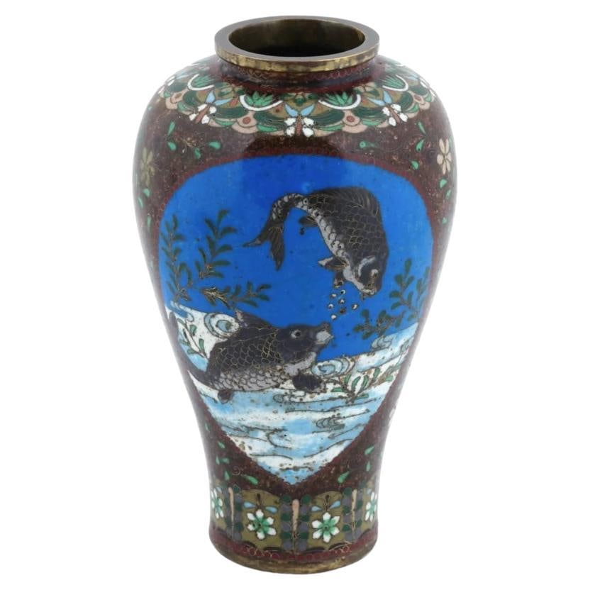 Antique Japanese Cloisonne Goldstone Enamel Fish and Mantis Amphora Shaped Vase: About the Item A vintage Japanese enamel over gilt copper vase. The amphora shaped vase is enameled with polychrome medallions depicting fish in a pond and a mantis in blossoming flowers surrounded by
