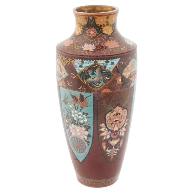 Antique Japanese Cloisonne Enamel Gold Stone Vase: About the Item An antique Japanese enamel metal vase. The amphora shaped vase is enameled with polychrome medallions with birds, Phoenix birds, insects, blossoming flowers surrounded by floral, foliag