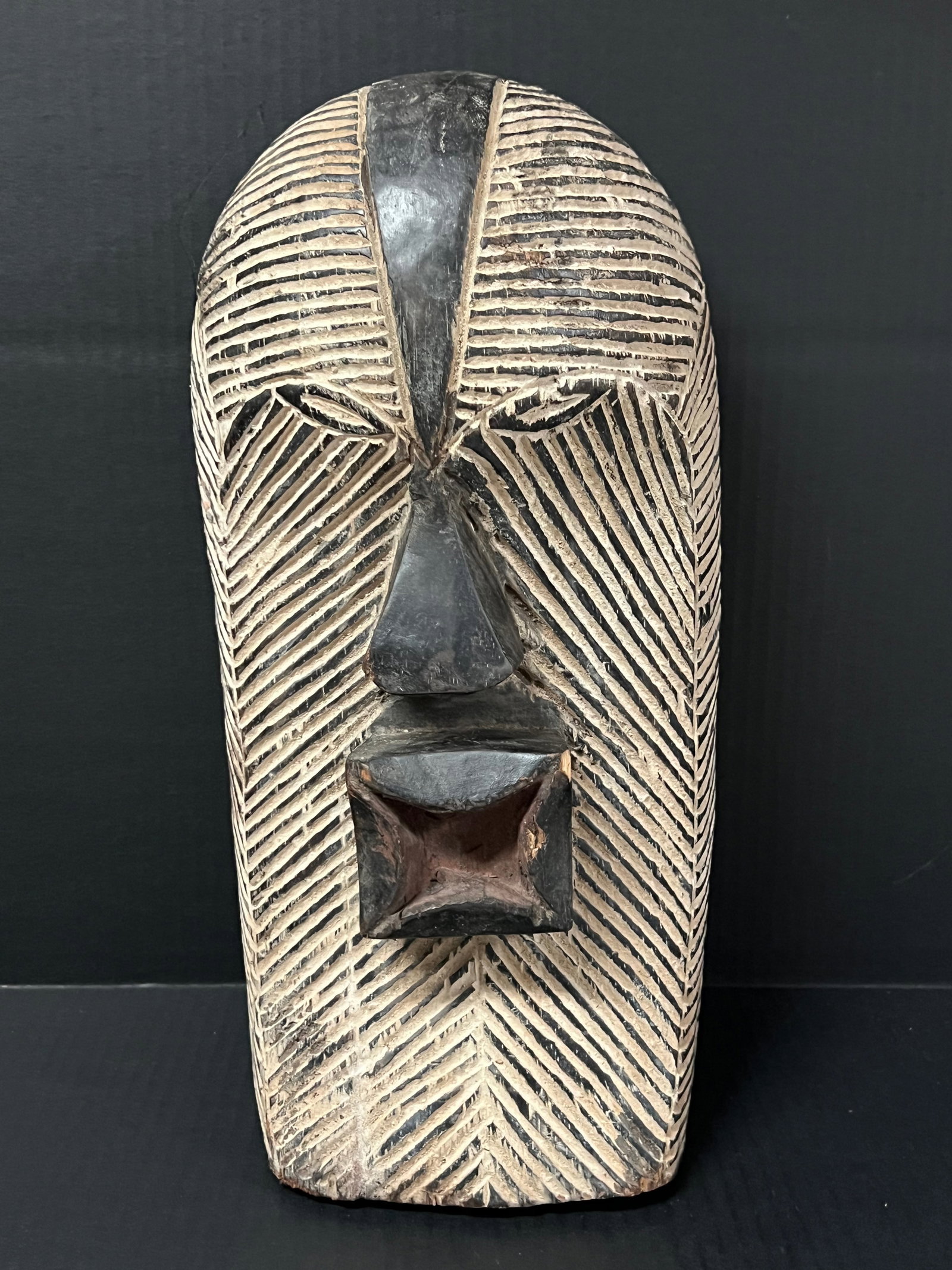 Songye Mask: Title: Songye Mask Date/Period: Late 20th Century Dimension: 17.5" h x 8.5" w Material: Wood Additional Information: African Tribal Art Songye Mask Reserve: $100.00 Shipping: Domestic: Flat-rate of $3