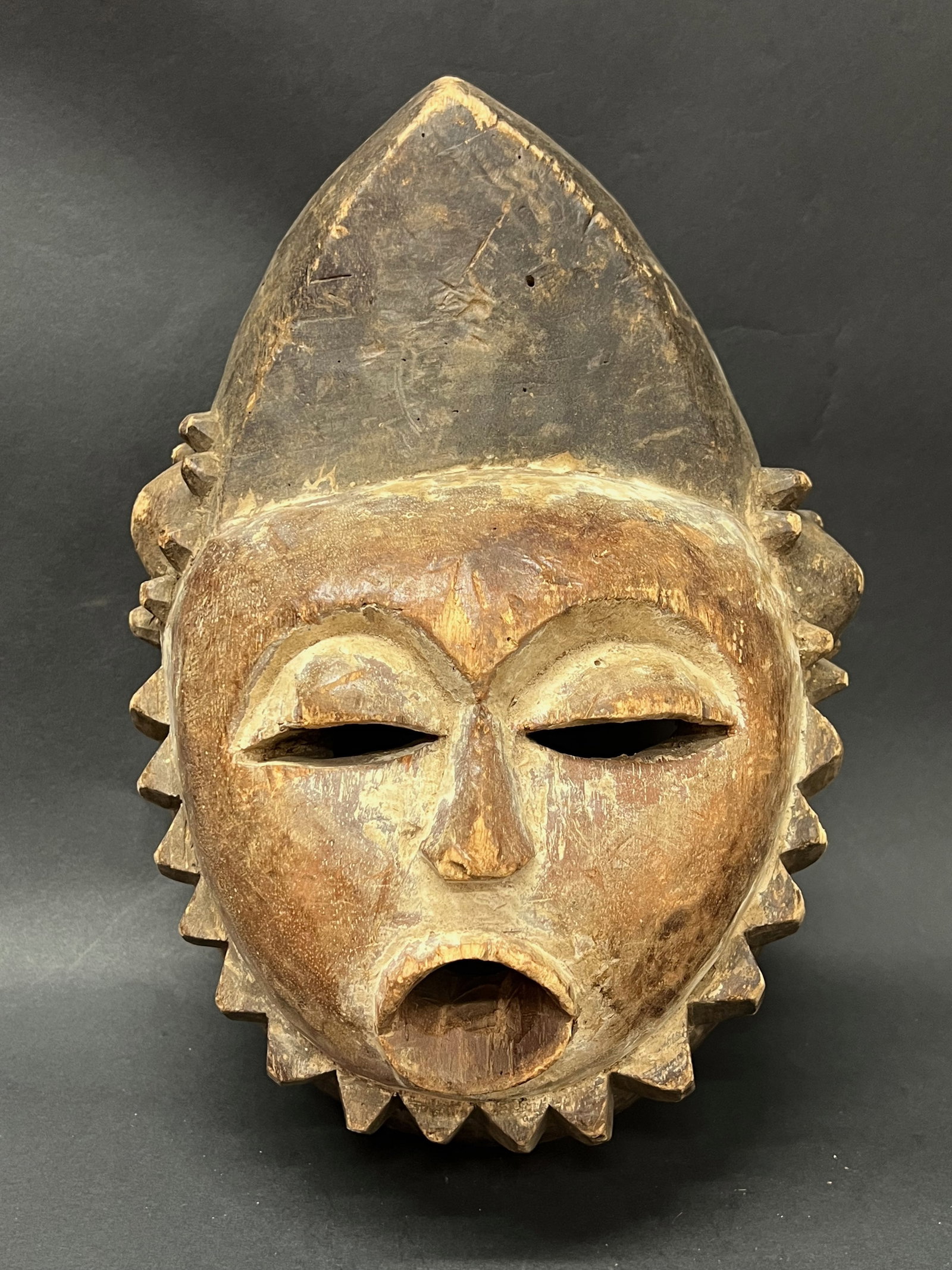 Mbunda Mask: Title: Mbunda Mask Date/Period: Late 20th Century Dimension: 13" h x 10" w Material: Wood Additional Information: African Tribal Art Mbunda Mask Reserve: $100.00 Shipping: Domestic: Flat-rate of $40.0