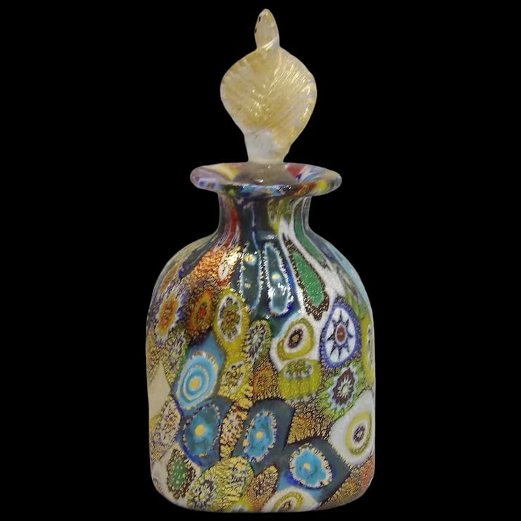 Miniature Millefiori Murano Venetian Italian Blown Art Glass Gold Fleck Perfume Bottle with Stopper: This Miniature Millefiori Murano Venetian Italian Blown Art Glass Gold Fleck Perfume Bottle with Stopper Circa 1980’s is in excellent condition. It measures 3 ¾” with stopper and is 1
