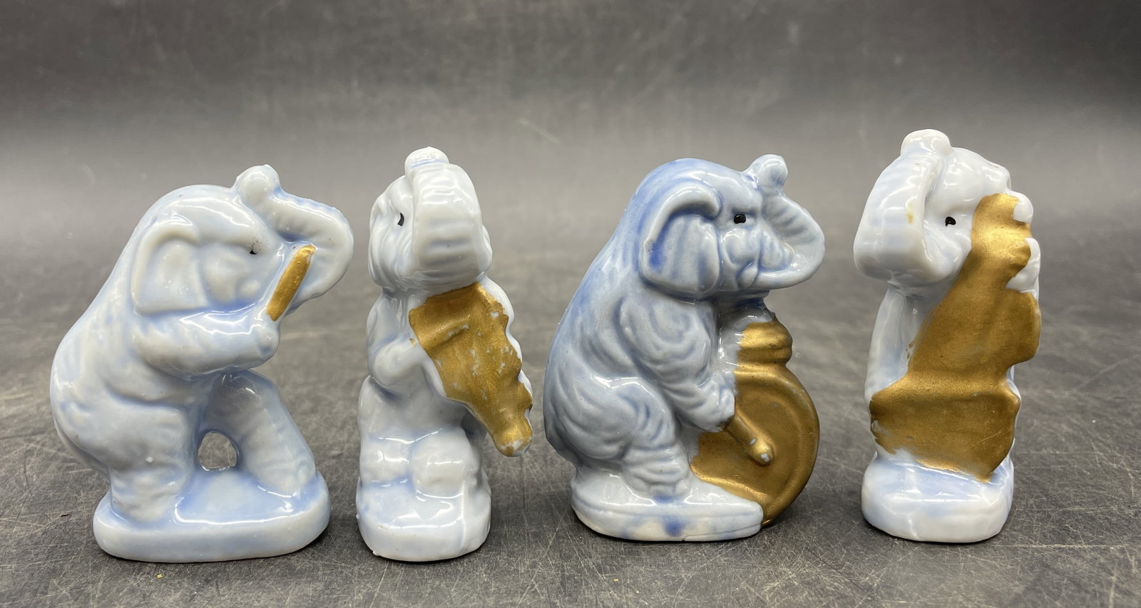 Vintage Japan 4 Pc Blue Elephant Band Orchestra: Title: Vintage Japan 4 Pc Blue Elephant Band Orchestra Date/Period: APPROX 1950'S Dimension: each piece approx 2.5" tall x 1.5" x 1" Material: CERAMIC Additional Information: Vintage Japan 4 Pc Blue E