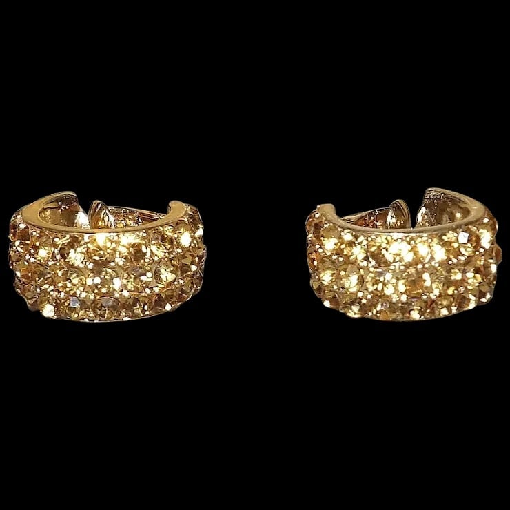 Elegant Dress Rhinestone Gold Tone Clip on Earrings: This pair of Elegant Dress Rhinestone Gold Tone Clip on Earrings is in excellent to mint condition. No missing stones and clips are strong so they will not fall off. No makers marks just a beautiful p