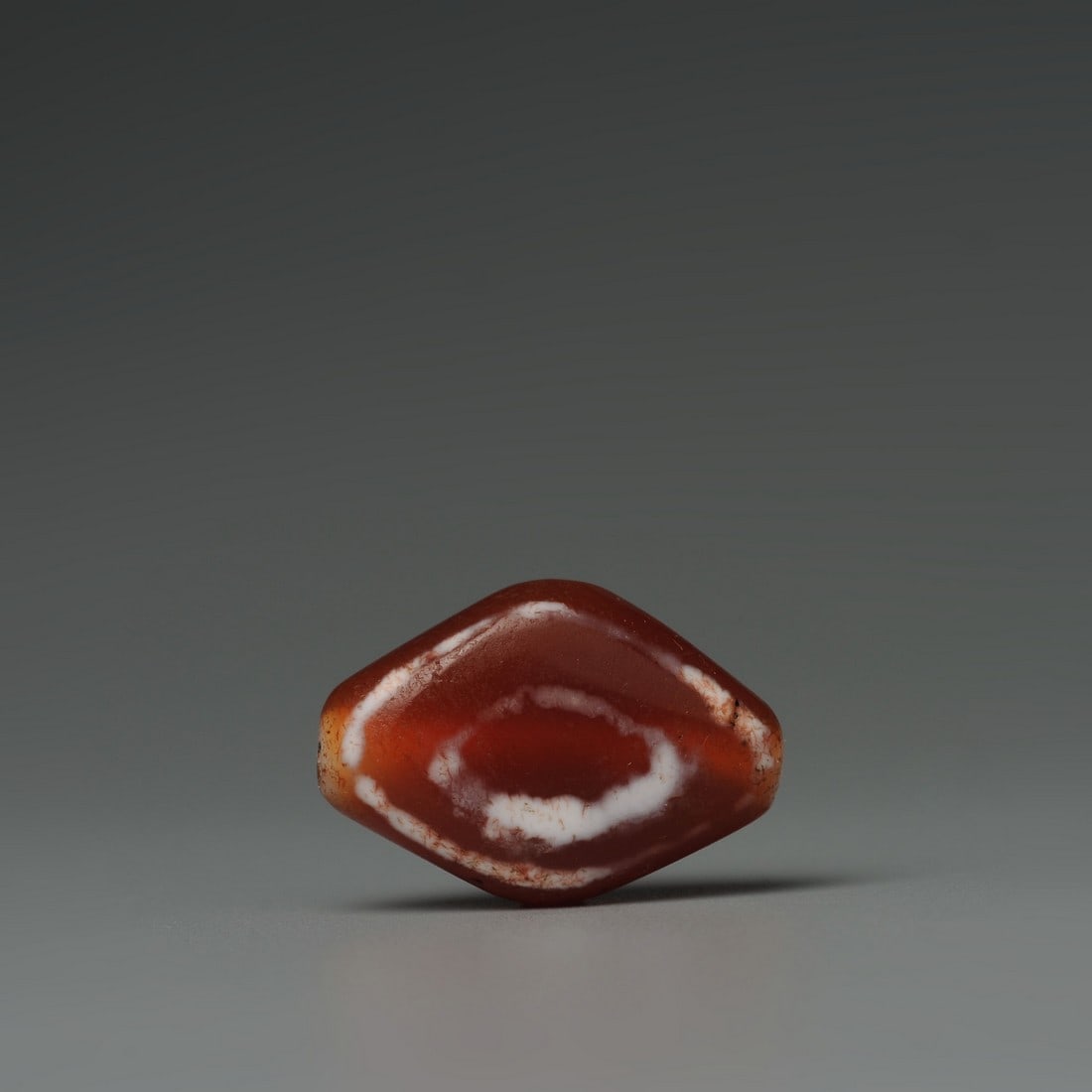 Tibetan agate eyes dzi beads: Title:Tibetan agate eyes dzi beads Origin:Asian private collection Date/Period:19th Century Materials:Agate bedas Description:ize: 25x18x9 mm Tibetan Himalayan antique Dzi beads Reserve: $50.00 Shippi