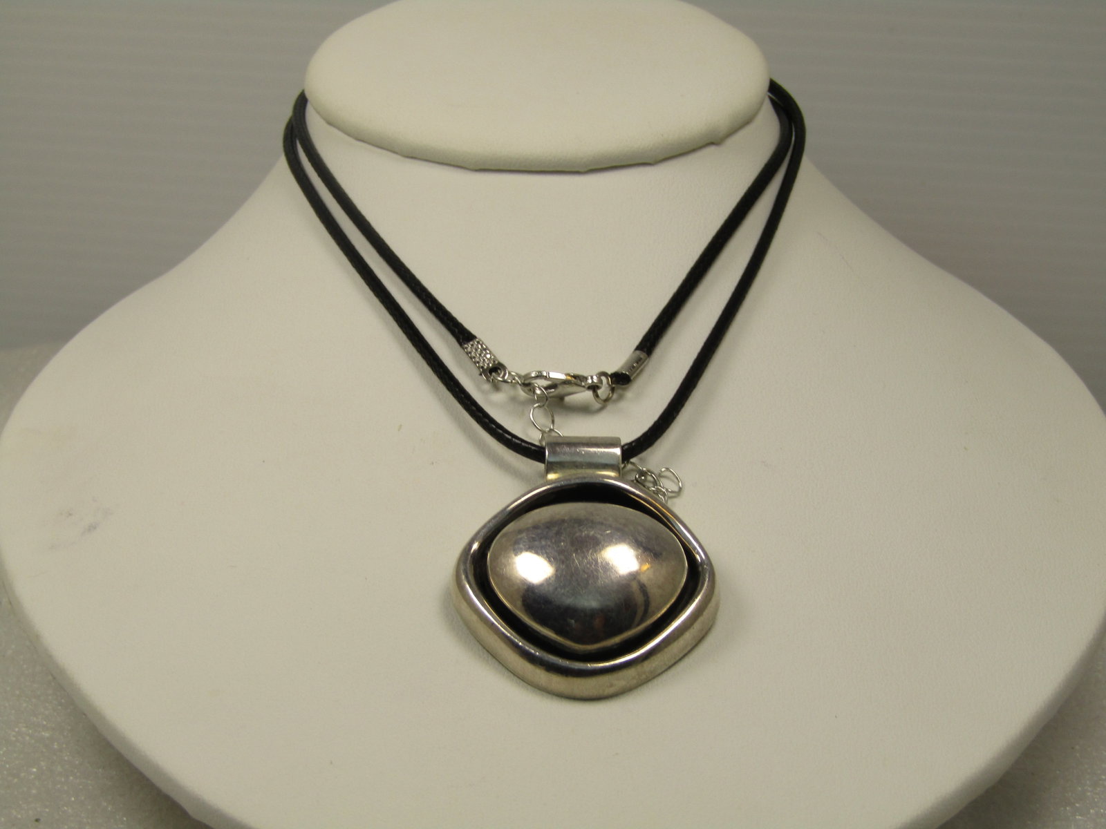 Vintage Sterling Pendant Necklace, Modernist, Mexico, .925 Co, 24"-26", 1980's-1990's: Vintage Sterling Pendant Necklace, Modernist, Mexico, .925 Co., 24"-26".. 1980's-1990's. The pendant has a rounded traingular center with recessed frame around that and wide bail. It is marked .925 an