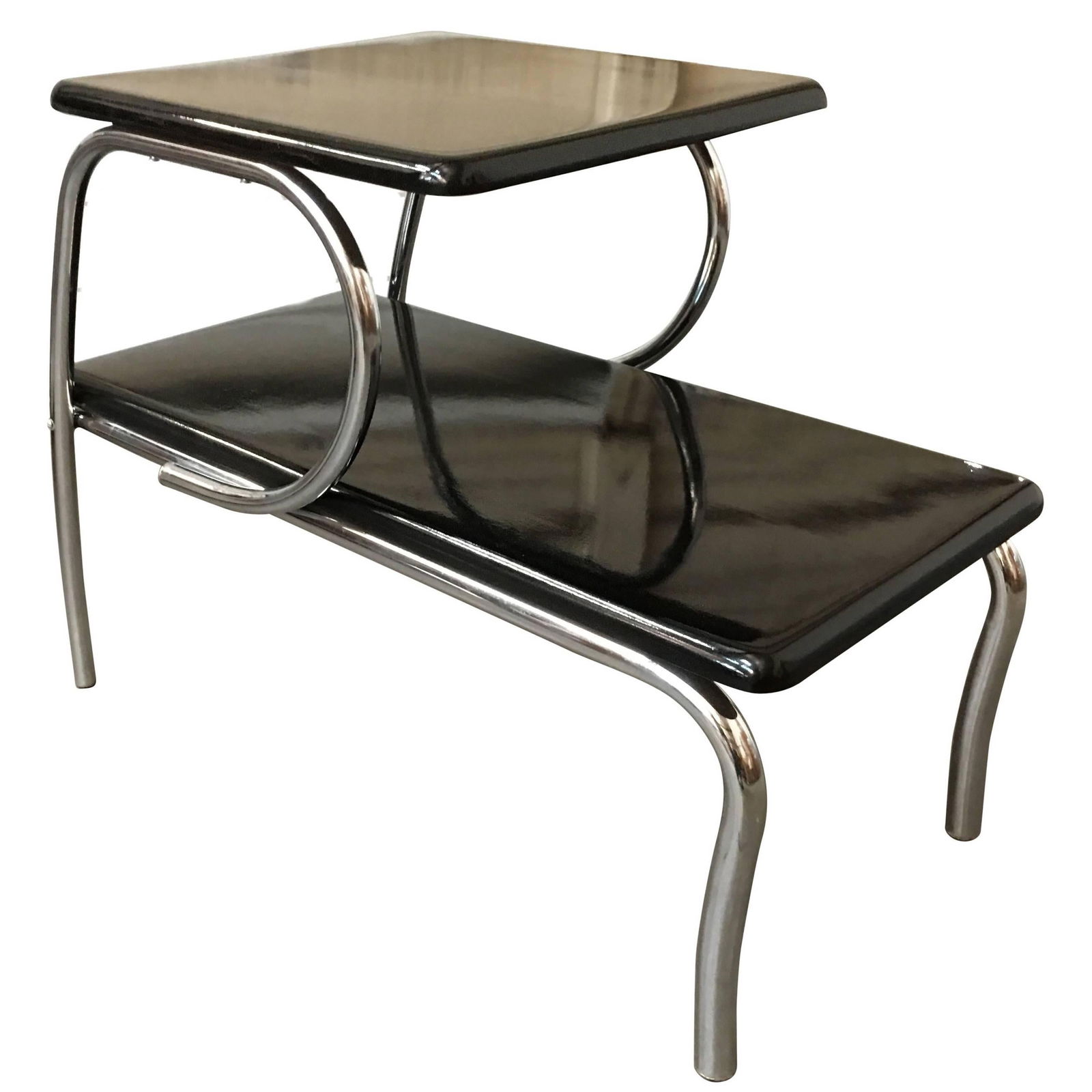 Wolfgang Hoffmann Style Art Deco Chrome Tubular & Lacquer Micarta Side Table: About the Item Art Deco side lamp table inspired by Wolfgang Hoffmann featuring a chromed round metal tubular frame in the "P" shaped legs that meet at the floor with two-tier black Lacquer style lami