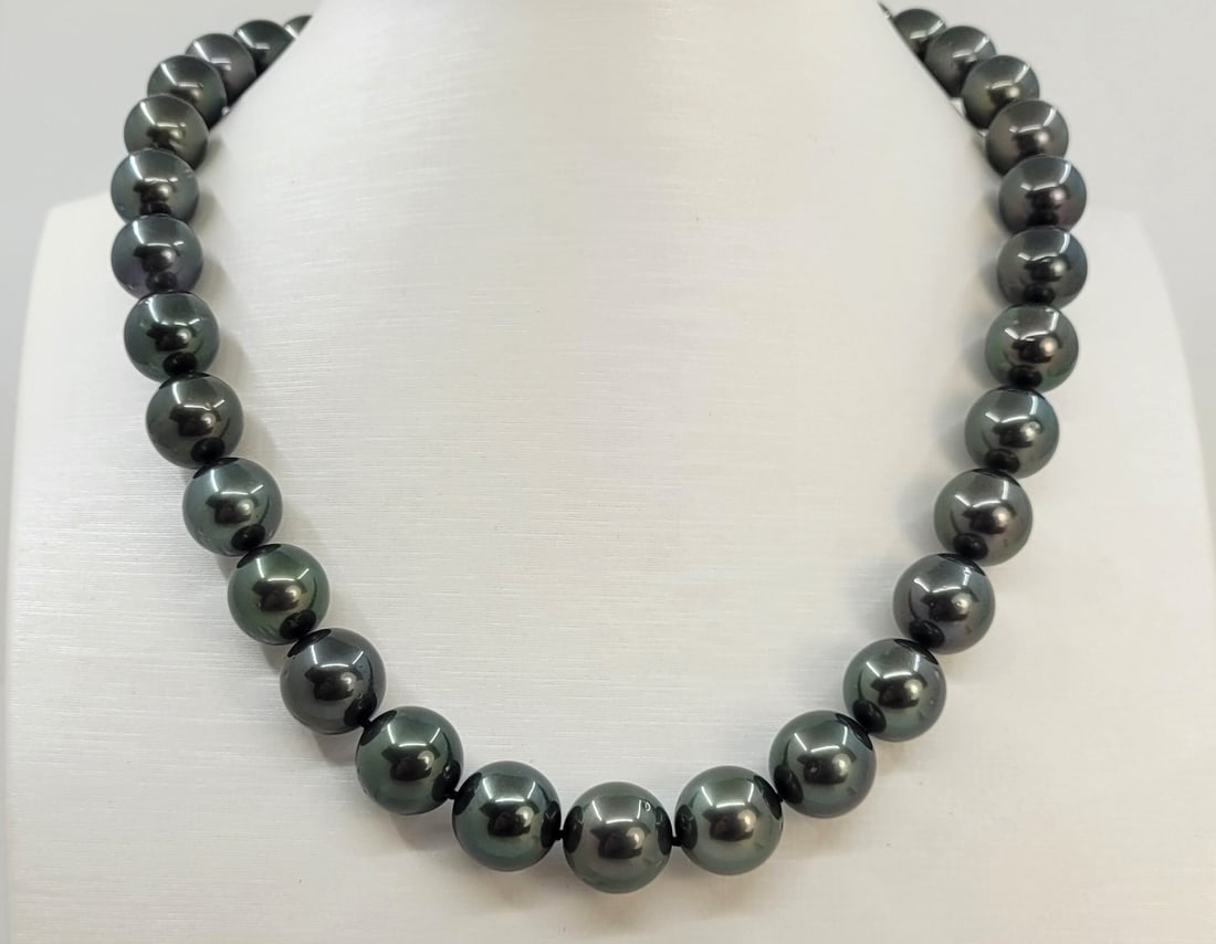PSL Certified Tahitian Pearls - 10.1x12.1mm Necklace: Title:PSL Certified Tahitian Pearls - 10.1x12.1mm Necklace Description:This necklace is in the category of the Tahitian Pearls according to the tested results and the P.S.L criteria. Emerging from the