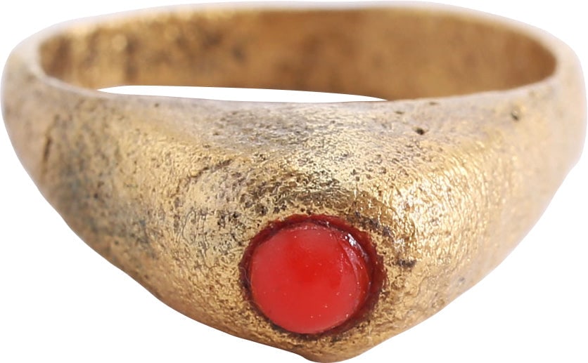 EUROPEAN LADIES FASHION RING C.1300-1400: Gilt bronze, size 4 3/4. Narrow band, 2.8mm, flaring to the shoulders. Tall bezel with a relief triangle each side, mounting a red “stone”, probably replaced. Some wear from use and surfac