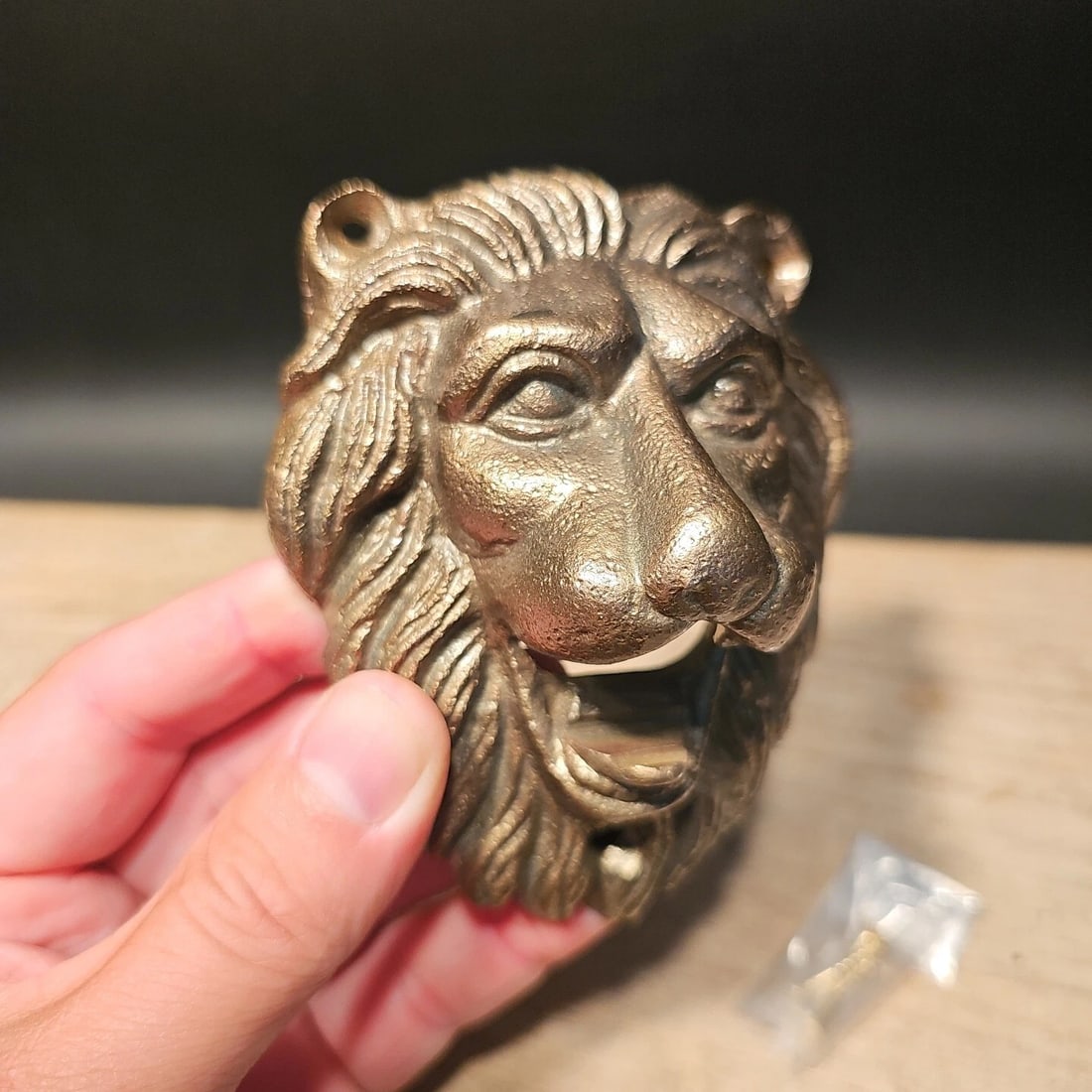 Cast Iron Lion Wall mount Bottle Opener: 4" Tall x 3 1/4" Wide Great reproduction cast iron bottle opener. This piece was made to look just like an antique, but is new. Reserve: $20.00 Shipping: Domestic: Flat-rate of $9.00 to anywhere withi
