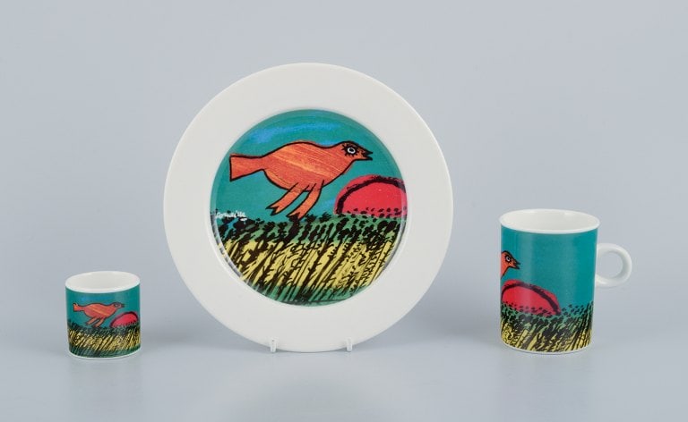 Corneille (Guillaume Cornelis van Beverloo), Dutch CoBrA artist (1922-2010). Coffee cup, plate, and: Corneille (Guillaume Cornelis van Beverloo), Dutch CoBrA artist (1922-2010). Coffee cup, plate, and egg cup in porcelain decorated with birds over a field with sunrise. From the 1980s/90s. In perfect