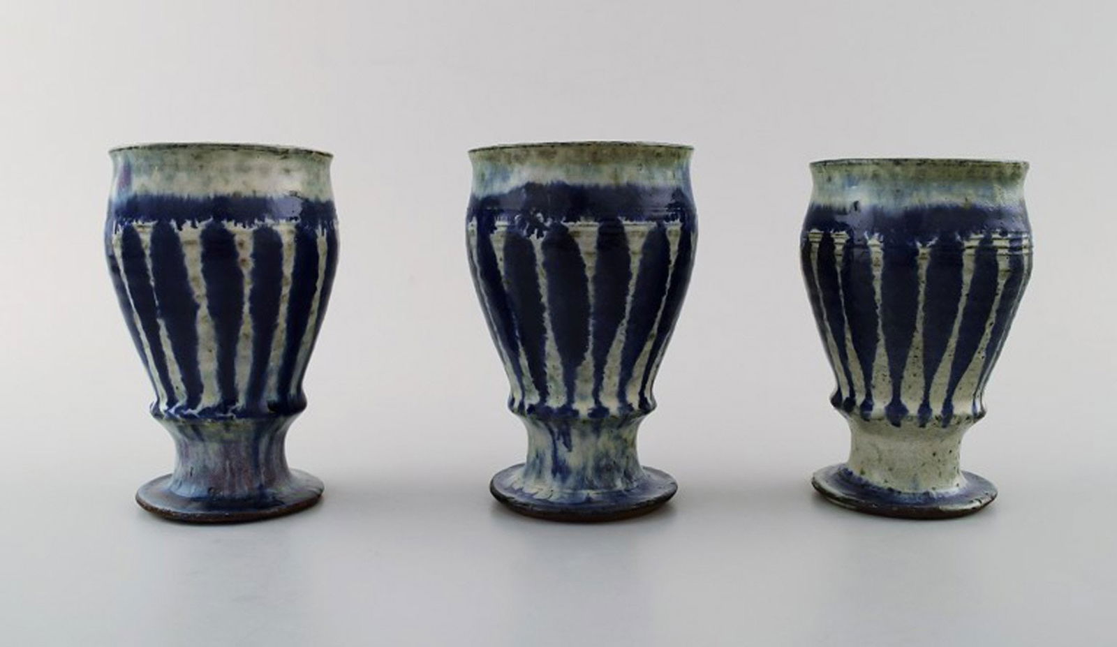 Gutte Eriksen, own workshop, three ceramic cups.: Gutte Eriksen, own workshop, three ceramic cups. Stamped. Measures 11 x 7 cm. In perfect condition. Reserve: $350.00 Shipping: Domestic: Shipping rates are determined by destination International: For