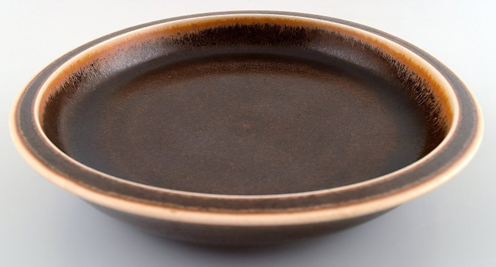 Saxbo, large ceramic dish/bowl, beautiful brown glaze.: Saxbo, large ceramic dish/bowl, beautiful brown glaze. Yin yang stamp. Model No. 66. In perfect condition. Measures 23 x 4.5 cm. Reserve: $210.00 Shipping: Domestic: Shipping rates are determined by d