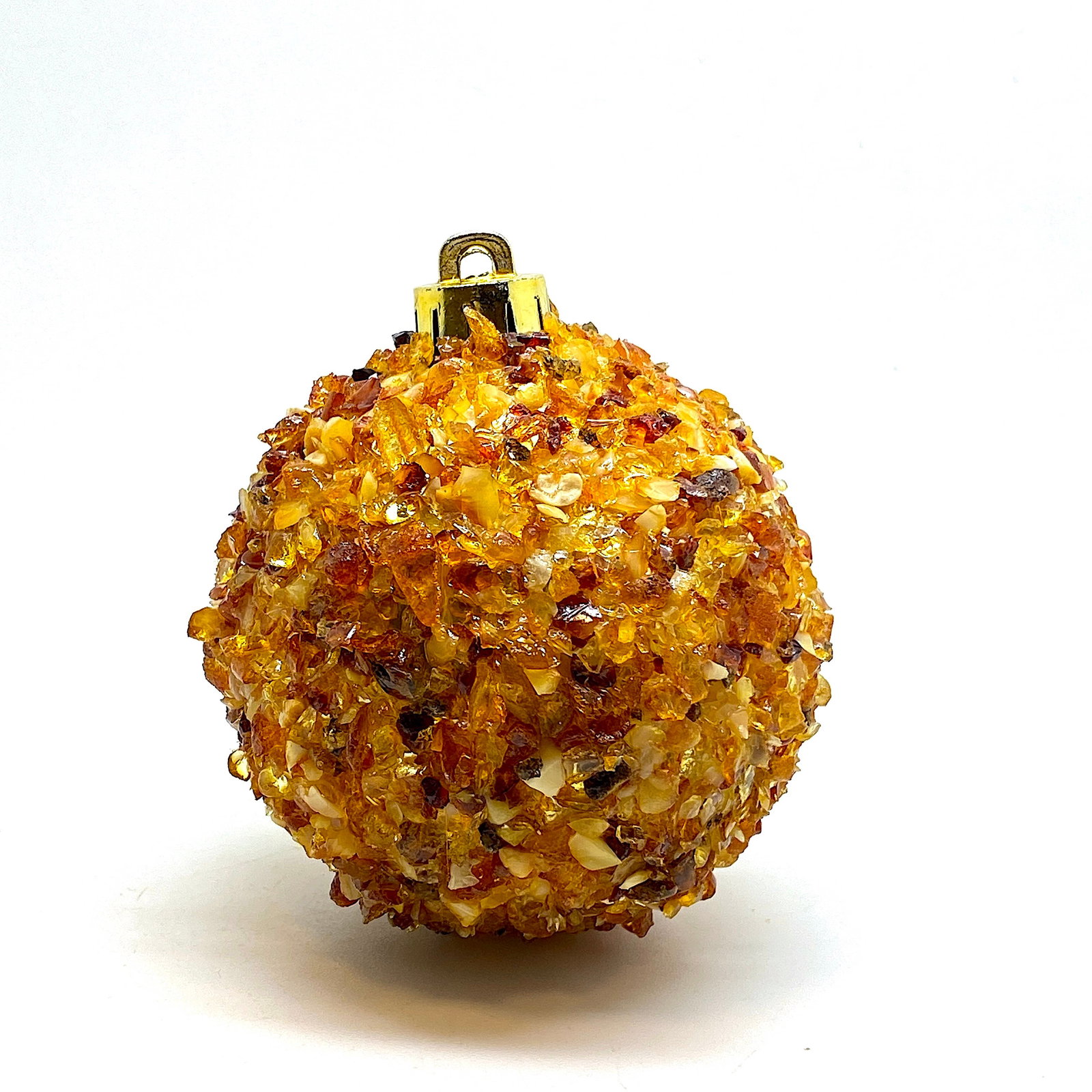 Natural Amber Christmas tree ball: Title: Natural Amber Christmas tree ball Maker:Unknown Origin: Unknown Date/Period:Unknown Materials:Amber Size:Size: 6.5 x 6.5 x 7 cm Description:Natural Amber Christmas tree ball Size: 6.5 x 6.5 x 7