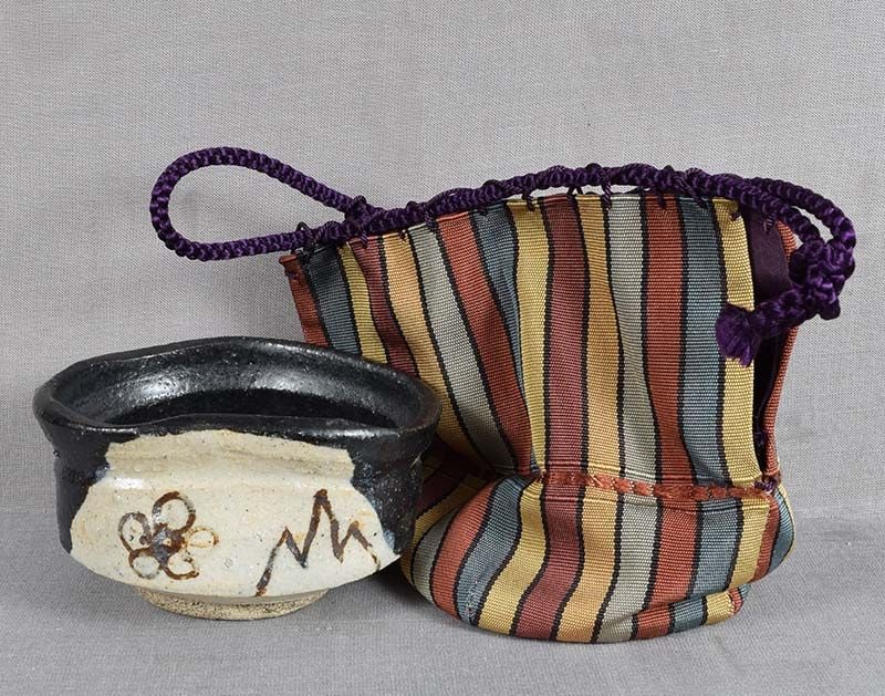 19c Kuro ORIBE SAKE CUP guinomi / yunomi: Unusual 19th century Japanese ceramic Kuro Oribe guinomi - a sake cup, can be used as a small yunomi - a tea cup. Comes with very well made shifuku (silk brocade storage bag). Superb free potting, the