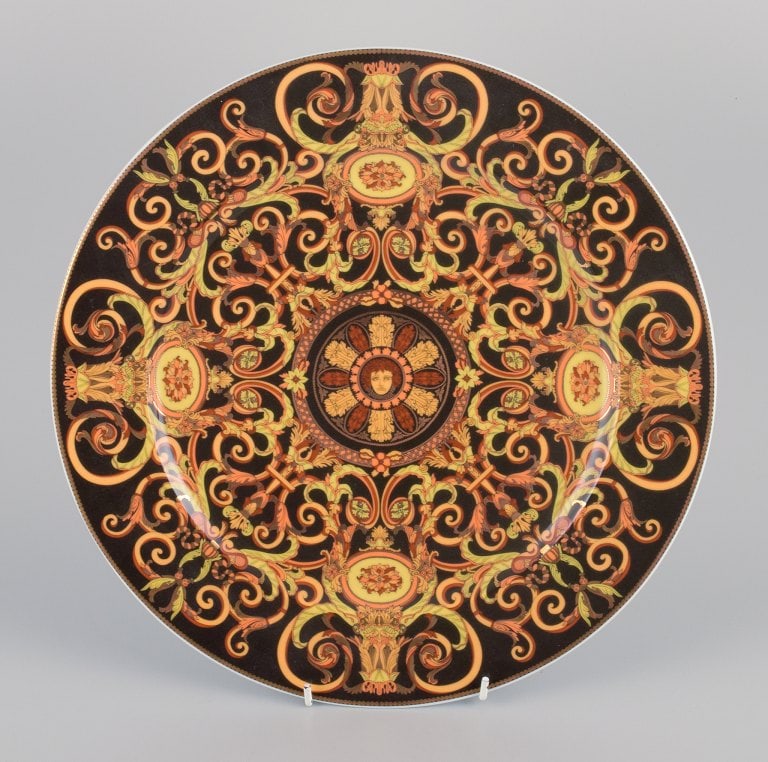 Versace for Rosenthal, large Barocco porcelain dish in shades of brown and orange.: Versace for Rosenthal, large Barocco porcelain dish in shades of brown and orange. Late 20th. c. In perfect condition. Marked. Dimensions: D 30.8 cm. Reserve: $252.00 Shipping: Domestic: Shipping rate