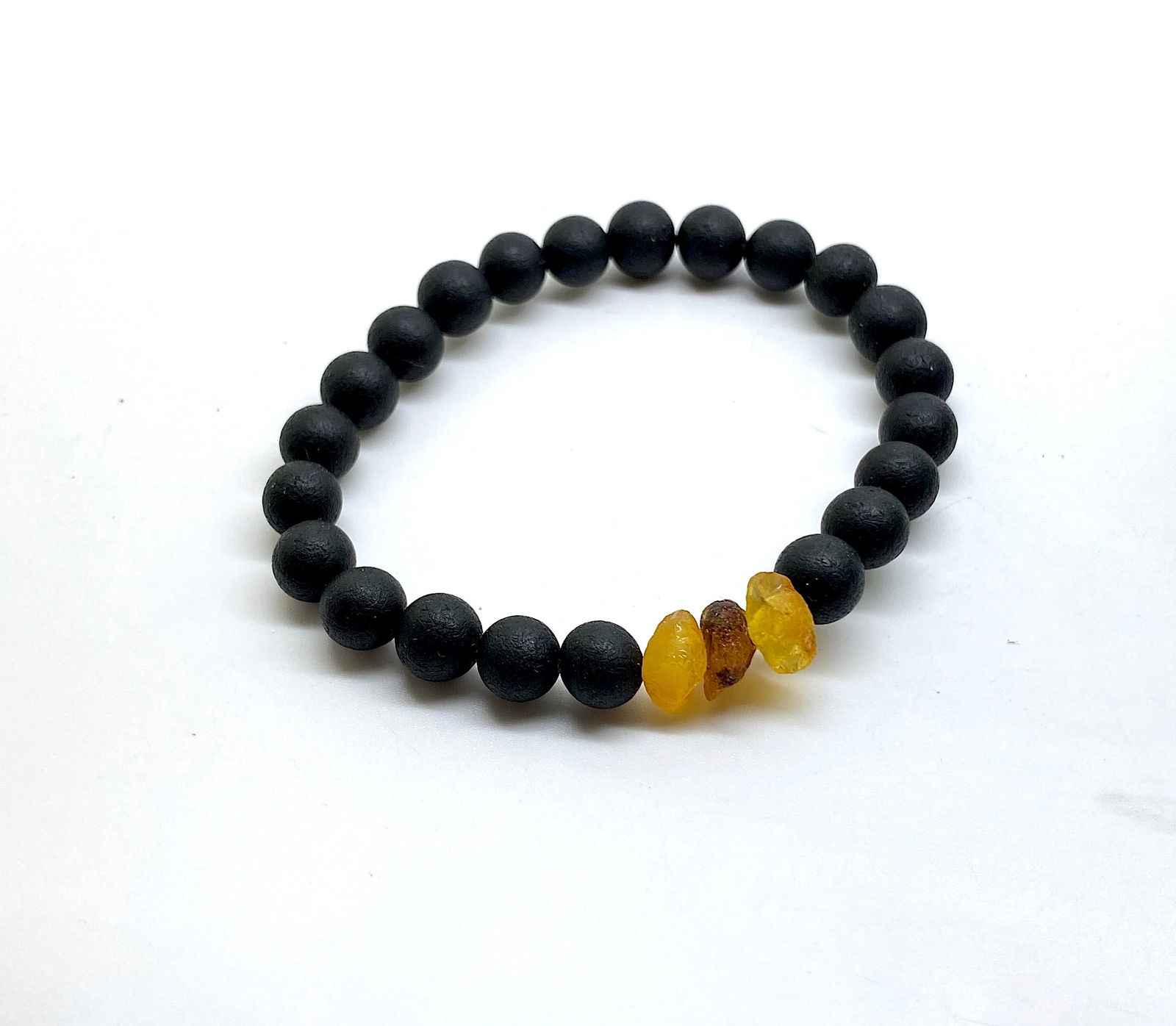 Phenomenal Amber Bracelet made from Round Amber beads: Title:Phenomenal Amber Bracelet made from Round Amber beads Metal:None Gemstone:Amber Weight:7.6 g Size:Bead size: 8.0 mm Bead size: 0.315 inches Made of:(Reconstituted Amber or Whole Stone):Reconstit