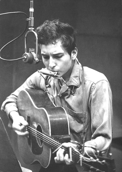 Bob Dylan Records His First Album For Columbia ' By Michael Ochs: Description ' Bob Dylan Records His First Album For Columbia ' by Michael Ochs Bob Dylan recording his first album, "Bob Dylan", in front of a microphone with an acoustic Gibson guitar and a harmonica