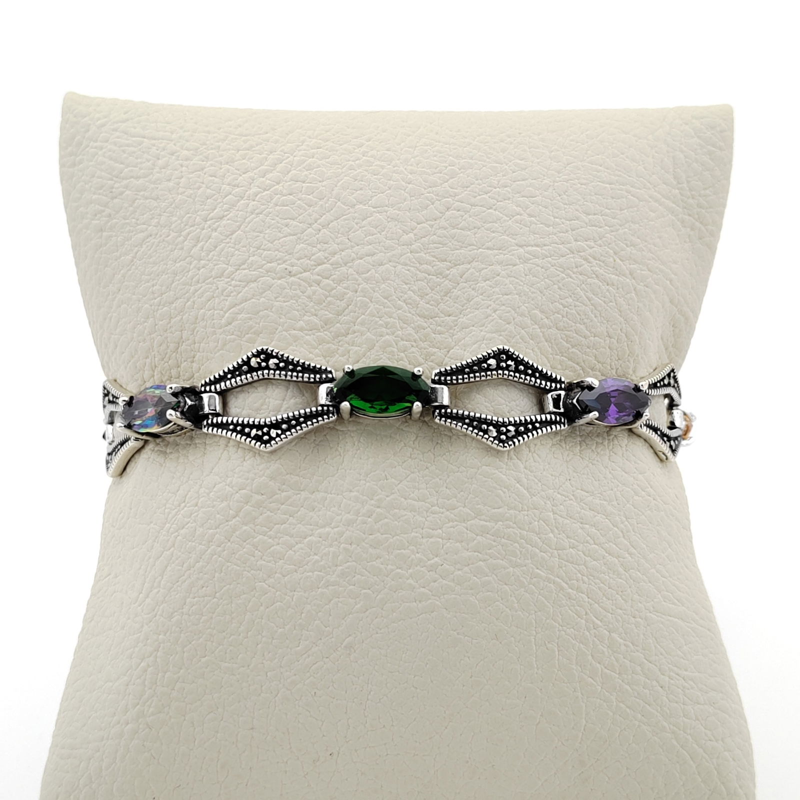 925 Sterling Silver Ladies Bracelet: Title: 925 Sterling Silver Ladies Bracelet Description: 925 Sterling Silver Ladies Bracelet Ornated with Purple,Blue,Green,Yellow Zircon,Mystic Topaz and Marcasite -Condition:New Weight:13.6g -Size:6.