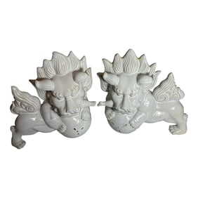 A Pair of Stylized Ceramic With White Glaze Chinese Foo Dogs