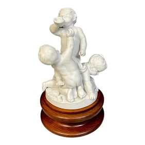 19th Century Sevres Biscuit Group of Three Frolicking Puttos