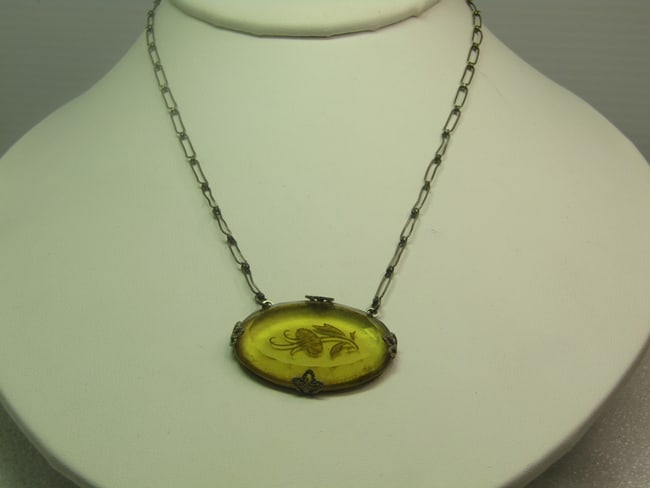 Antique Glass Reverse Cut Floral Necklace, Paperclip Chain, 15", 1920's-1930's: Antique Glass Reverse Cut Floral Necklace, Paperclip Chain, 15", 1920's-1930's. Yellow cut glass pendant with areverse cut flower that is set on the side with four wide decorative prongs holding it. I