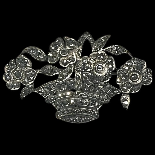 Art Deco Sterling Silver ?and Marcasite Flowers in Basket Brooch: Title: Art Deco Sterling Silver ?and Marcasite Flowers in Basket Brooch Description: Art Deco Silver ?and Marcasite Flowers in Basket Brooch Hallmarked: Sterling Weighs 8.5 grams Measures Approx. 2 x