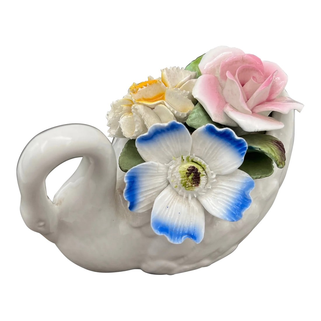 1980s Vintage Royale Stratford Staffordshire Capodimonte Style Swan With Flowers Figurine: Vintage Royale Stratford Capodimonte Style Swan is handcrafted in Staffordshire, England, using fine bone china. It features beautifully detailed blue, pink, and yellow flowers with green leaves on it