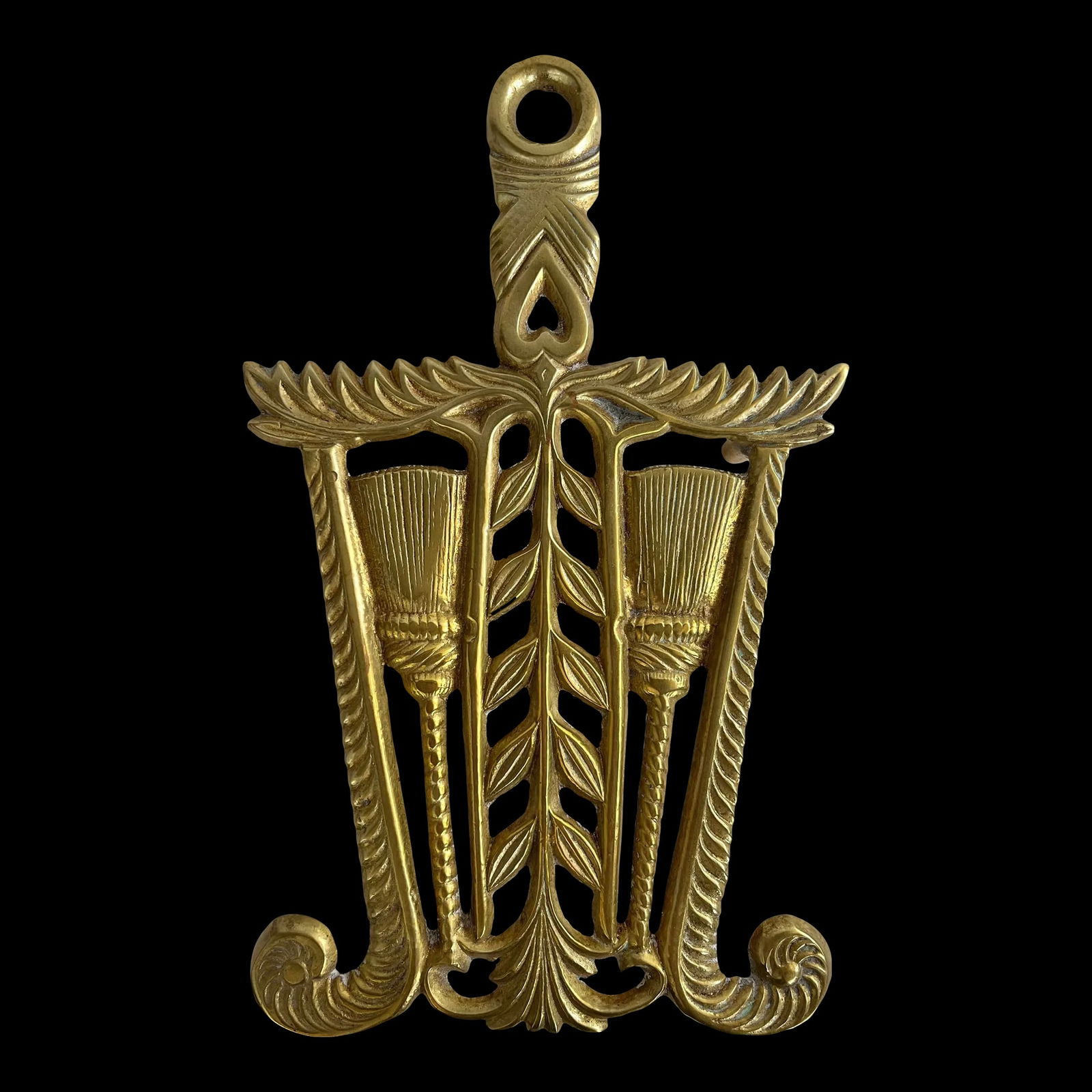 Mid-Century Virginia Metalcrafters Solid Brass Tassels, Roping and Leaves Trivet: Vintage Virginia Metalcrafters Solid Brass Trivet with an intricate design of roping, tassels, and leaves. Solid brass trivet is heavy and weighs 1 lb. and measures 8.5"h x 5.25"w x 1"h with 4 brass f