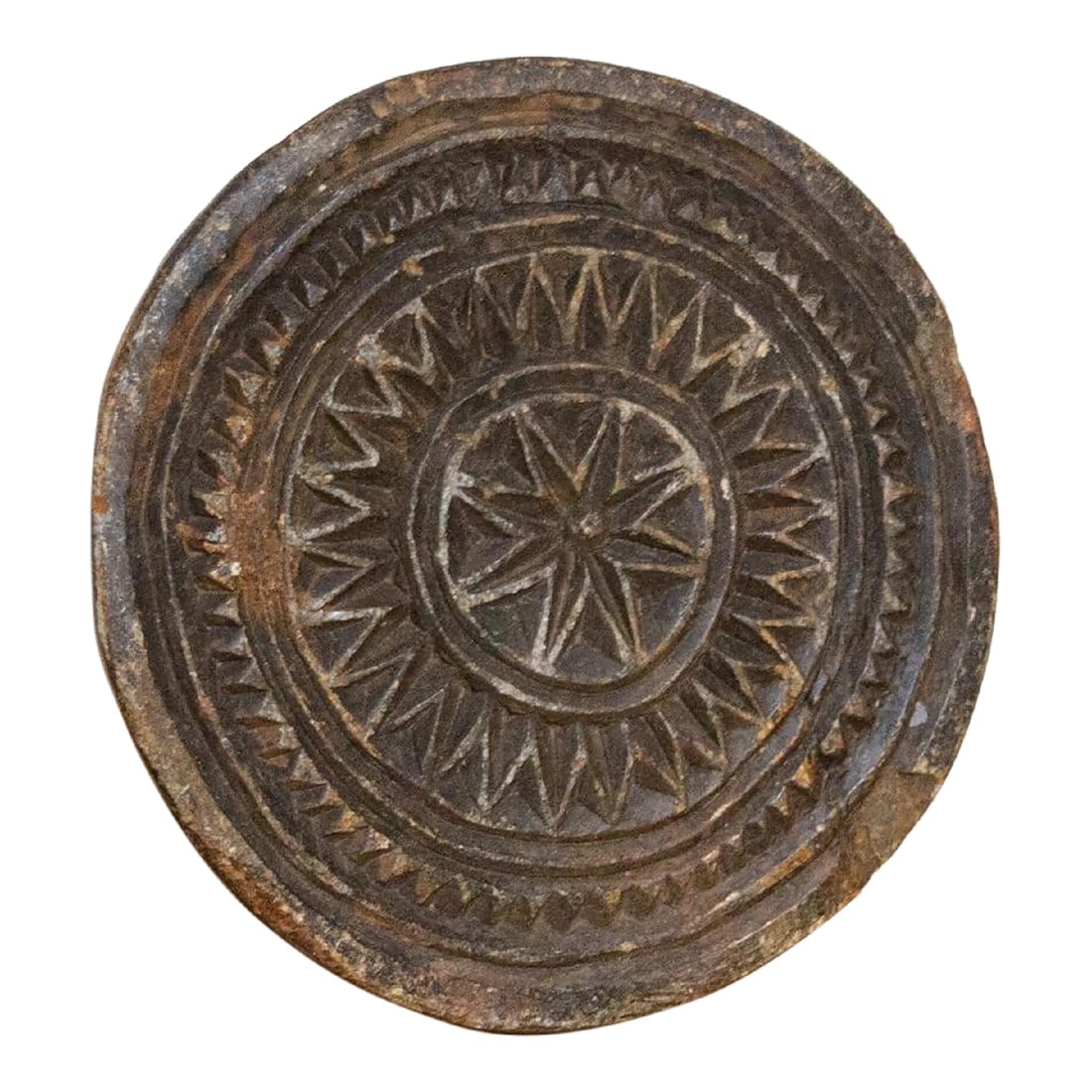 Ishita Indian Stone Plate: Vintage and primitive stone trivet plate, crafted from black stone with hand-carved tribal and geometric designs. Originally this piece was used to make Indian cooking molds. Great as a table top acce