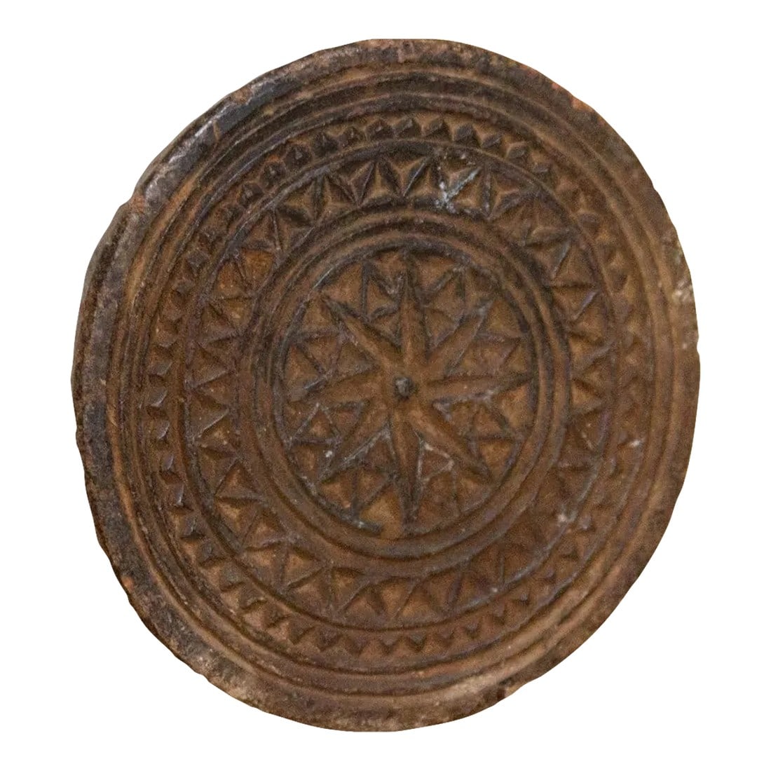 Vintage Carved Stone Trivet: Vintage and primitive stone trivet plate, crafted from black stone with hand-carved tribal and geometric designs. Originally this piece was used to make Indian cooking molds. Great as a table top acce