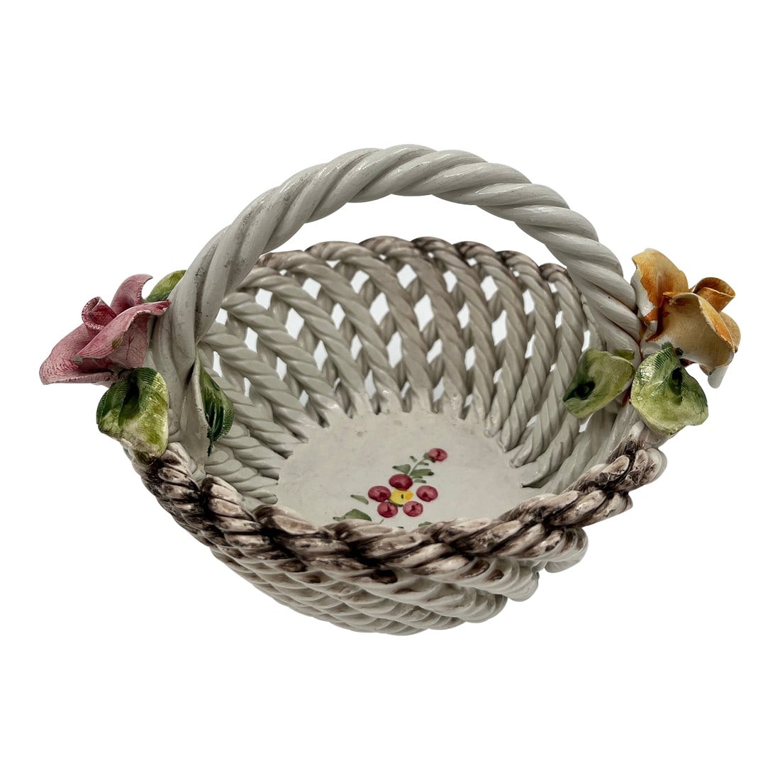Vintage Italian Capodimonte Woven Rose Basket: Vintage Italian Capodimonte Woven Rose Basket. This beautifully detailed woven basket features applied roses with leaves on each side, one pink and one yellow. Hand-painted florals adorn the base of t