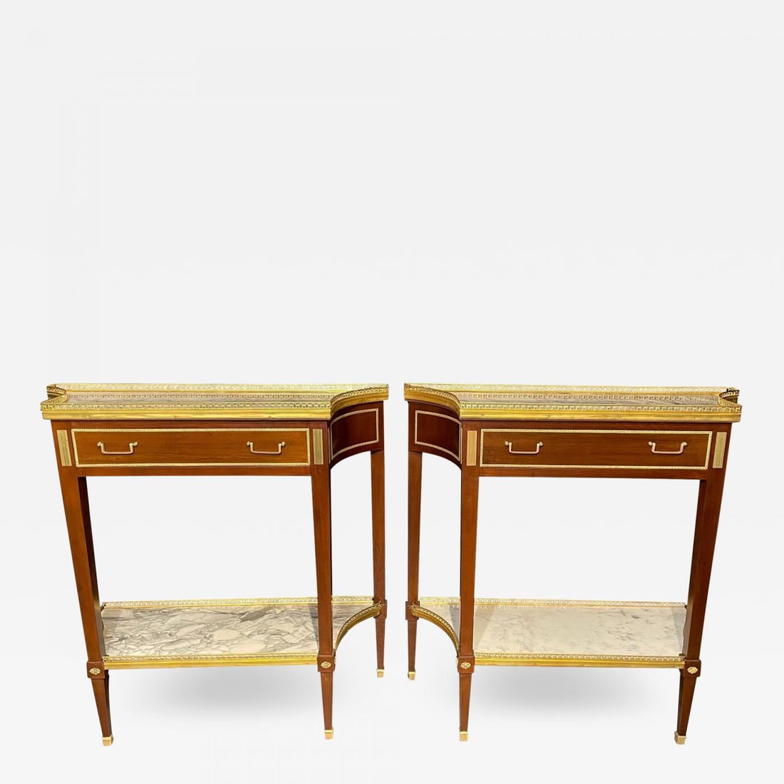 Pair of Russian Neoclassical Console Tables, Sofa Tables or Bedside Stands: Title: Pair of Russian Neoclassical Console Tables, Sofa Tables or Bedside StandsDescription: A pair of Russian style console tables having the Maison Jansen look and flair for design. This finely cra
