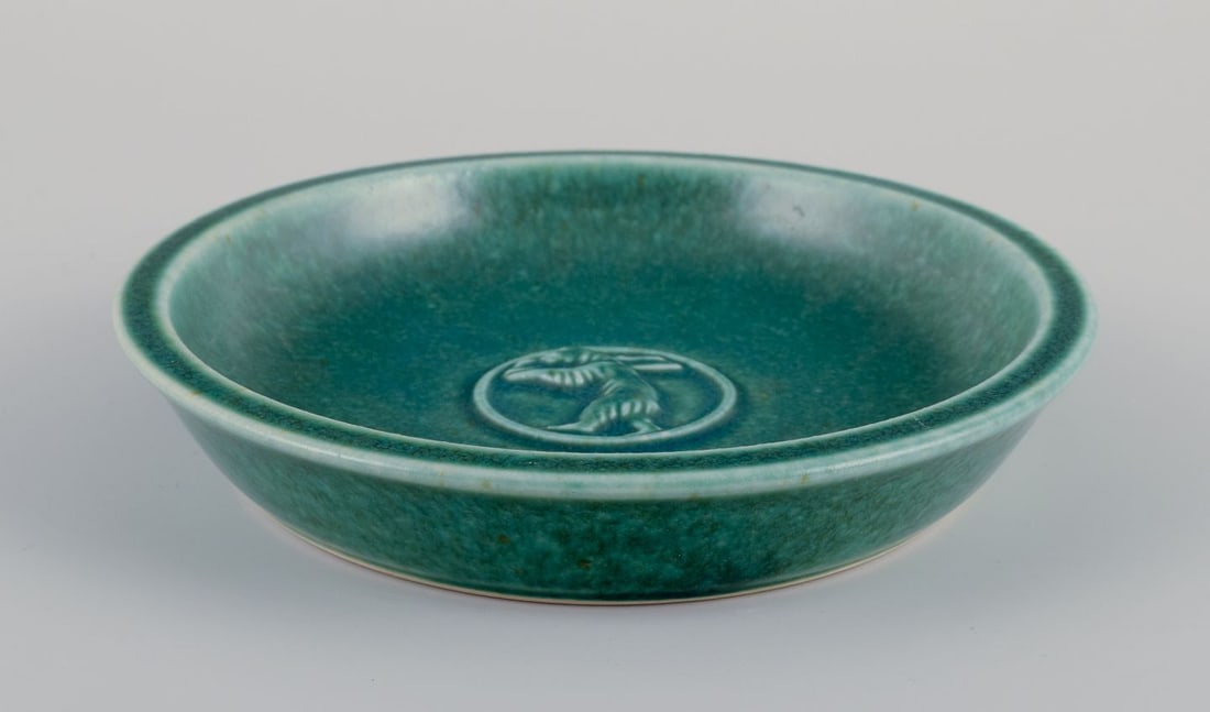 Saxbo, Denmark. Small ceramic bowl with a motif of a standing bear. Mid-20th C.: Saxbo, Denmark. Small ceramic bowl featuring a motif of a standing bear. Glaze in green tones. Mid-20th century. Marked. Excellent condition. Dimensions: Diameter 15.3 cm x Height 3.0 cm. Reserve: $25