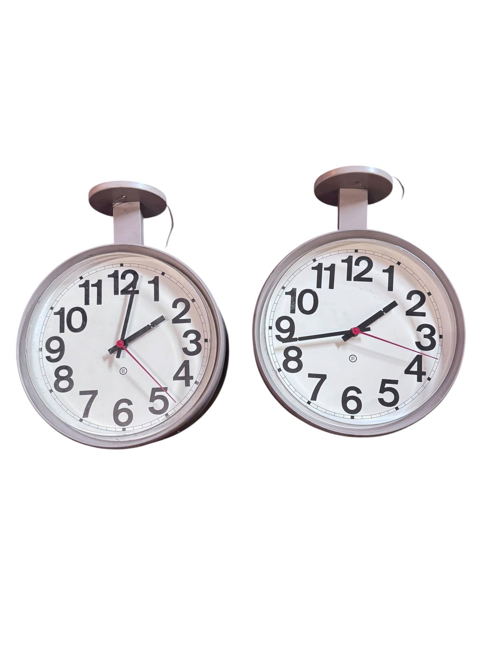 Vintage Industrial Double Sided School Clock - Pair: Vintage from before 2000 Vintage Industrial Double Sided School Clock - Pair The clocks feature a grey paint metal body and a clear glass cover. This pair of unique time pieces would be eclectic decor