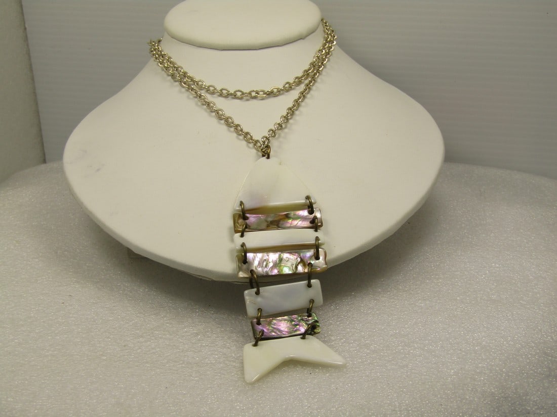 Vintage Mother-of-Pearl Articulated Fish Necklace, 26", 1960's-1970's.: Vintage Mother-of-Pearl Articulated Fish Necklace, 26", 1960's-1970's. The fish is appx. 3.5" long and 1.25" wide. The chain is a silver tone textured link that is appx. 3.5mm wide with a spring ring 