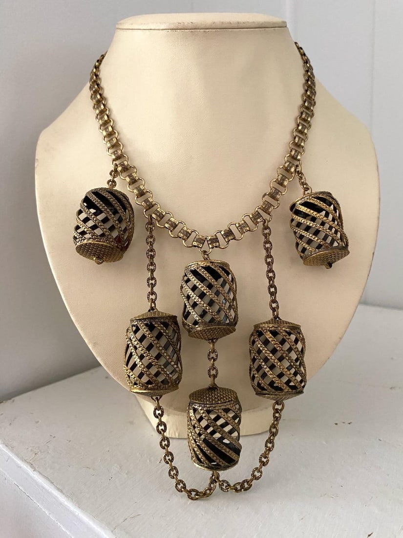 Vintage 1930s Brass Bib Necklace Possibly Early Miriam Haskell 16.5 inches: Vintage 1970s YSL White Chain Belt Yves Saint Laurent S M L White plastic rings Materials: Metal, plastic White plastic rings Goldtone connectors 2 rows Hook closure Wear as a belt - at waist or slung