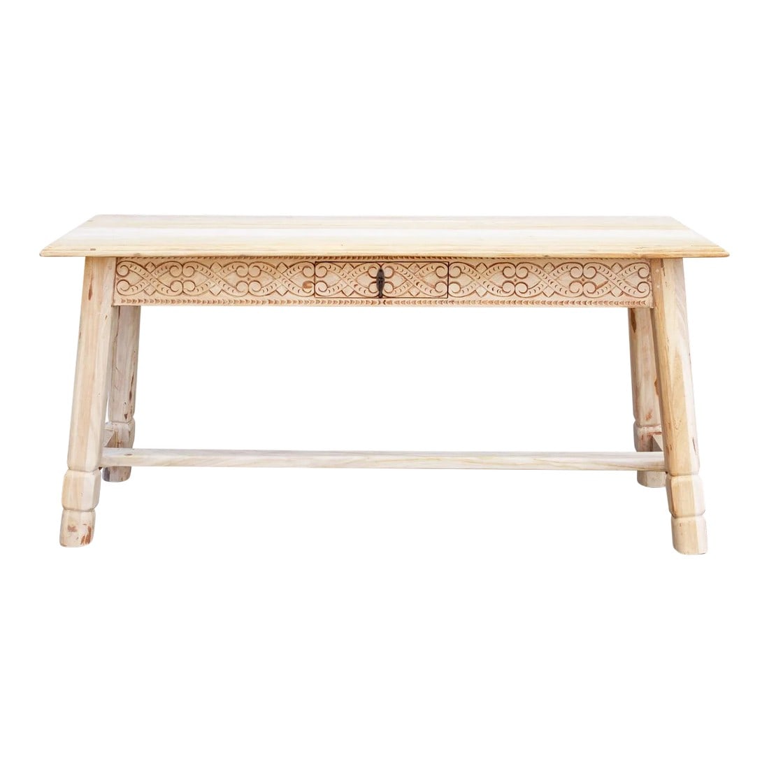 Bleached Carved Tavern Console Table: A gracefully carved tavern table that features rounded chunky legs and one center drawer, underneath this console has a lower wide shelf. This 17th Century style table wears a tribal motif apron and b