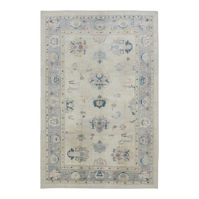 Early 21st Century Cream Handwoven Wool Turkish Oushak Rug in Pink & Blue Floral Design 6'1" X 9'1"