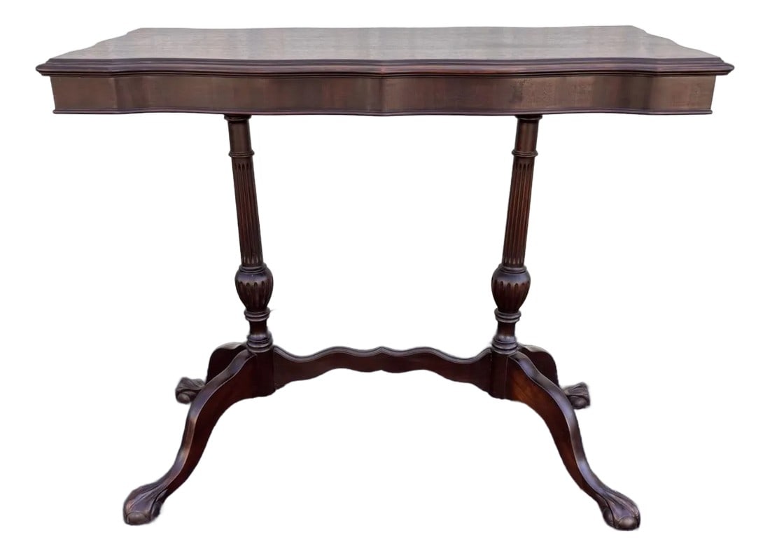 Traditional Victorian Mahogany Console Side Table- Clawfoot, Scalloped Edge: A stunning scalloped edge rectangular console or side table from the early 1900s. This side table is made entirely of dark mahogany wood, and features ball and claw feet connecting to carved dual pede