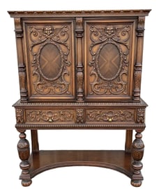 1910s Revell & Co Jacobean Carved Walnut Dining Cabinet