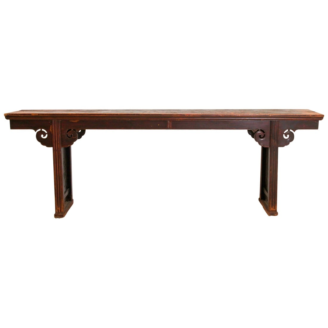 Chinese Elm Altar Large Console Table: Chinese console table with hand carved spandrels on both side of the table. A long elmwood altar or console table features side panels with carved, stylized ruyi motifs, a sacred fungus and with lingz