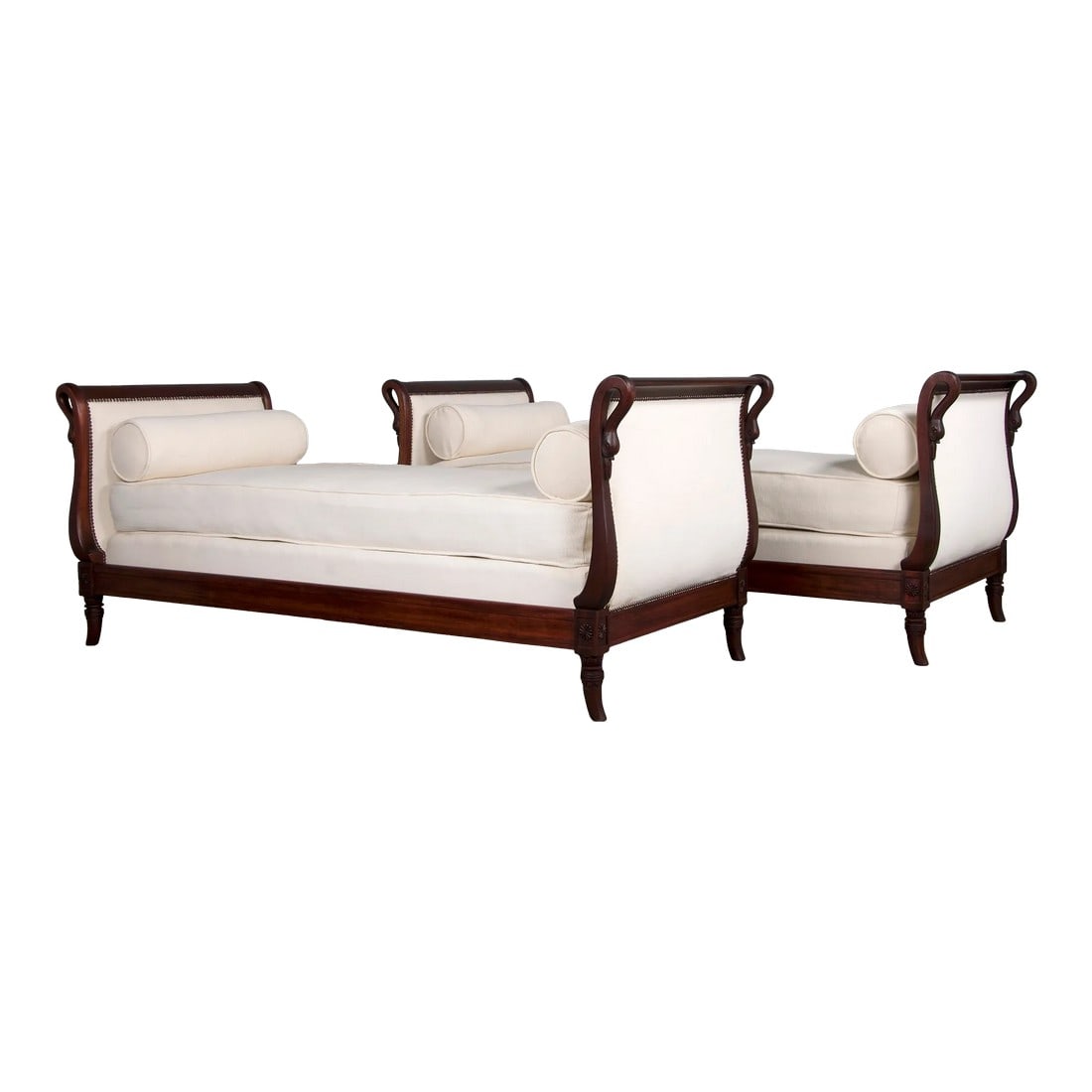 Antique French Empire Swan Neck Mahogany Daybeds W/ Cream Woven Fabric - a Pair: An exquisite pair of early 19th-century French Empire daybeds, sourced directly from Paris, France. Masterfully crafted from solid mahogany, these daybeds feature sleigh-shaped frames adorned with ele
