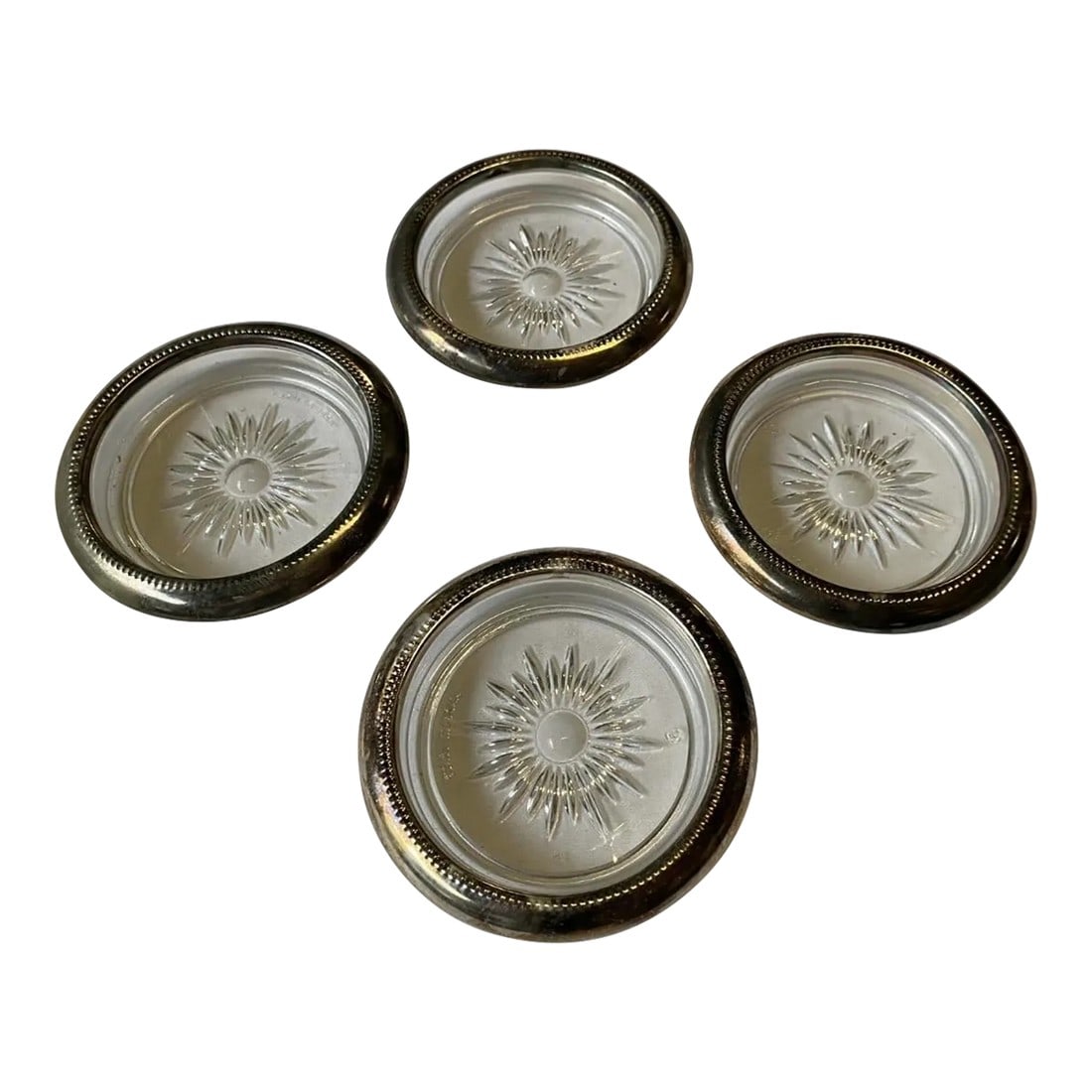 Vintage Silver-Tone Metal Rimmed Sun Coasters- Set of 4: A beautiful set of sun dishes, perfect for any home! Silver-tone rimmed and glass. Vintage Condition: Alterations: Original Condition Unaltered Imperfections: Some Imperfections Condition Notes: Perfe