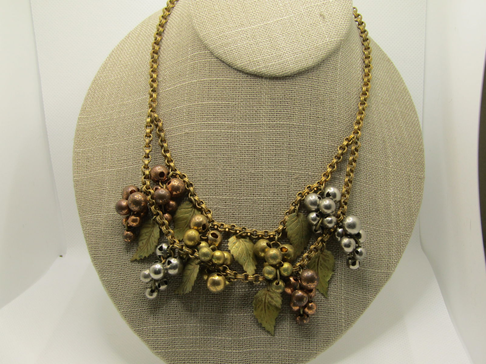 1940's Leaf & Cluster Beaded Drop Necklace, 15.75", Unsigned Miriam Haskell, Brass, Tri-Color: 1940's Leaf & Cluster Beaded Drop Necklace, 15.75", Unsigned Miriam Haskell, Brass, Tri-Color in gold tone, silver tone and copper tone cluster beads that drop from the alternating linked 4.5mm wide c