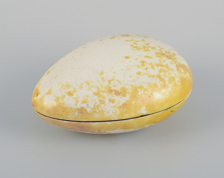 Hans Hedberg for Biot, France, egg-shaped lidded jar. Unique ceramic piece. Glaze in yellow and: Hans Hedberg for Biot, France, egg-shaped lidded jar. Unique ceramic piece. Glaze in yellow and white tones. Approx. 1980. Signed. In excellent condition with natural cracks from production. Dimension