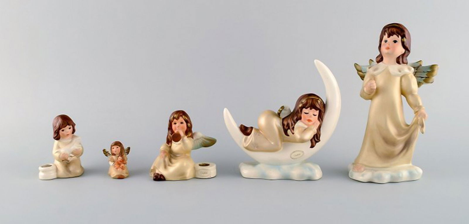 Goebel, West Germany. Five angels in porcelain. 1970 / 80s.: Goebel, West Germany. Five angels in porcelain. 1970 / 80s. Largest measures: 18.5 x 10.5 cm. In excellent condition. Stamped. Reserve: $238.00 Shipping: Domestic: Shipping rates are determined by de